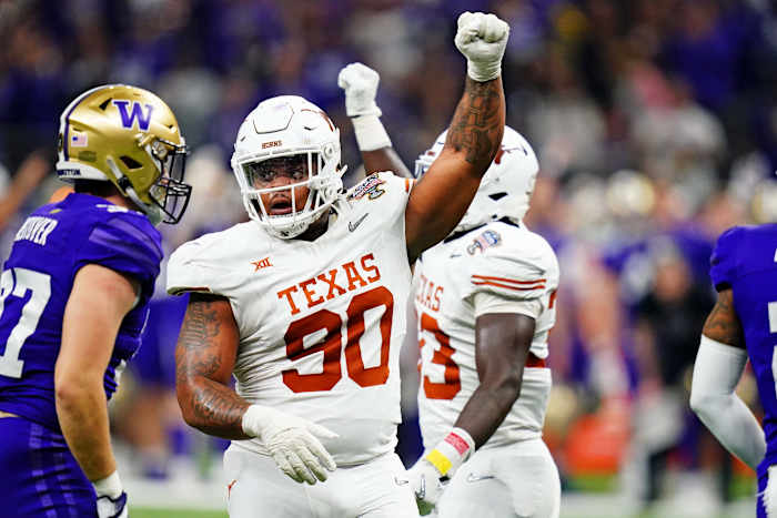 Longhorns defensive lineman Byron Murphy II (90) celebrates after a play during the second quarter in the 2024 Sugar Bowl college football playoff semifinal game at Caesars Superdome.